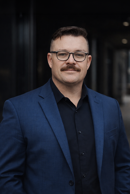 Portrait of Carson Wyndham, Associate.